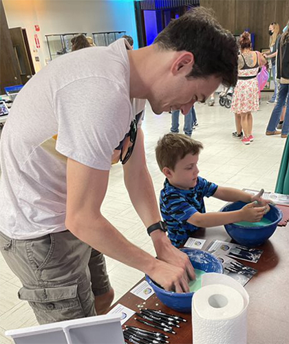 father and son playing with Oobleck