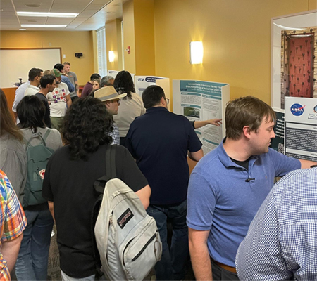 participants looking at research posters