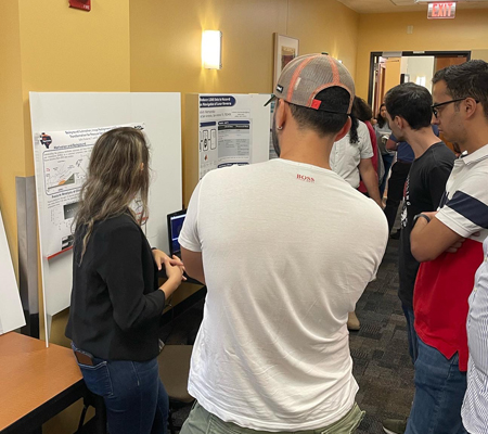 participants looking at research posters