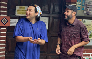 Sol Roberts-Lemus and Dr. Ernesto Ruelas-Inzunza release a bird from their hands