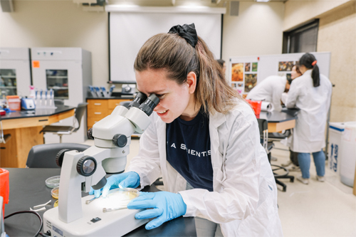 2023 COS Day - student and microscope