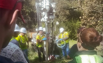 Students observing a drilling demonstration