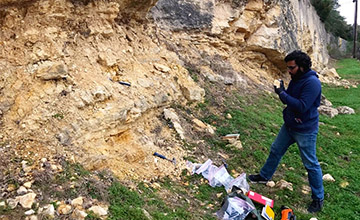 Student participant describing and measuring a section across the Eagle Ford – Austin Chalk Groups boundary in San Antonio