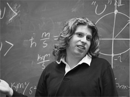 Bruce McOsker at board in front of class