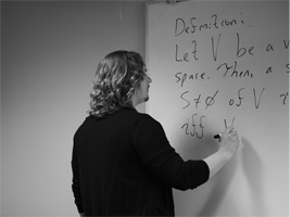 Chris LaValle writing on board