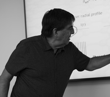 Dr. Alejandro Aceves writing on white board