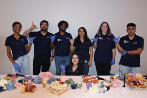 group picture at food table
