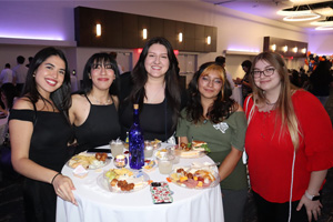 group standing at small table