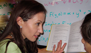 Erika explaining book to student