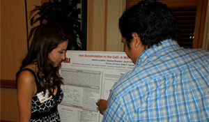 Erika and student at research poster