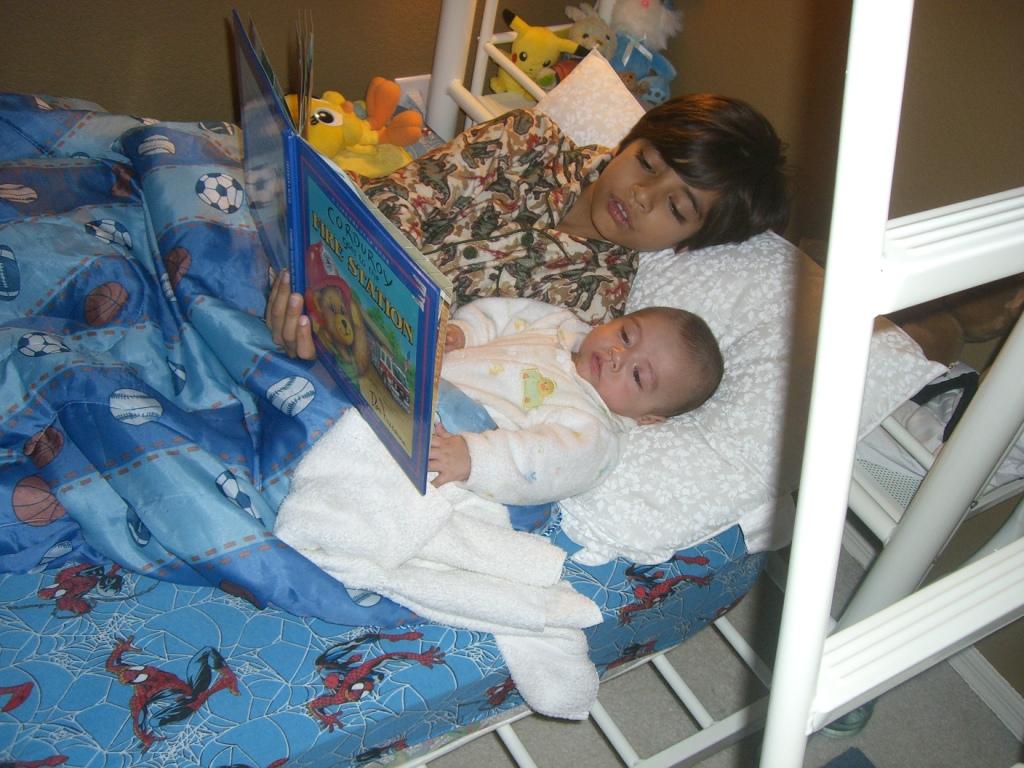 child reading to baby