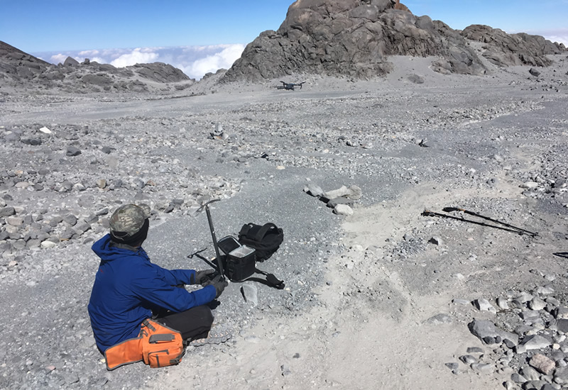 Sergio preparing for a drone flight at the foot of the glacier