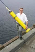 Stephen Riser on ship holding buoy
