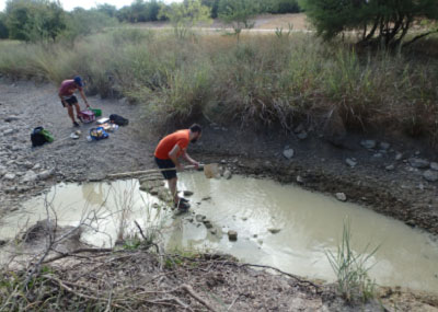 students in creek