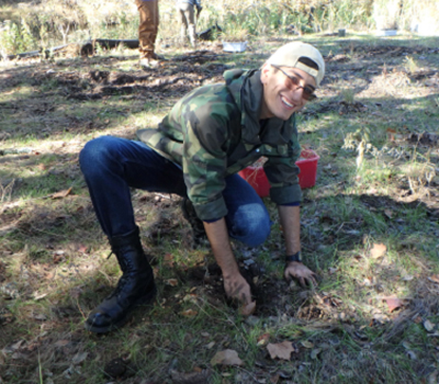 students planting grass