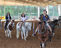 students riding horses