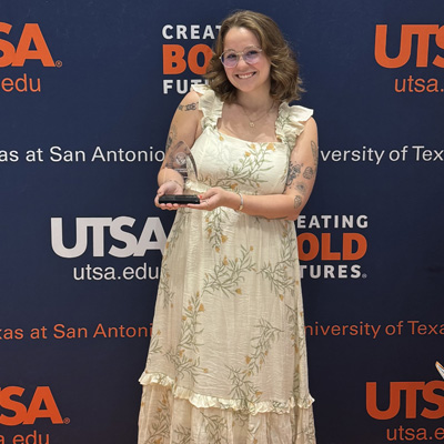 Cassidy Lane holding plaque