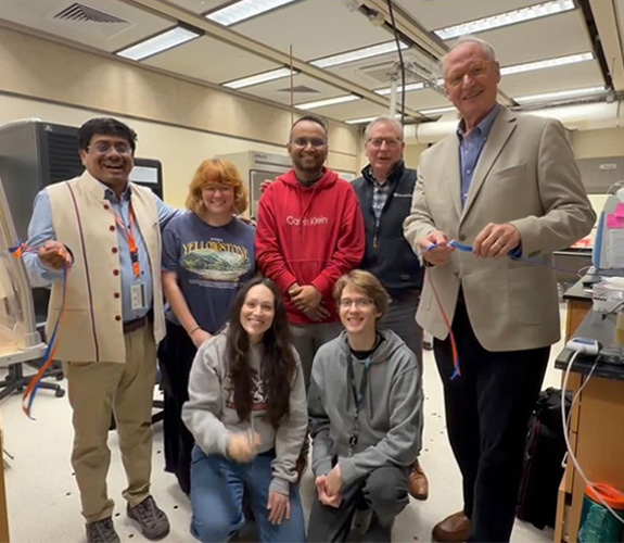 lab members and Dr. Eighmy after ribbon cutting