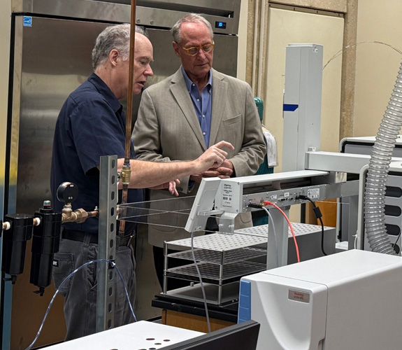 Dr. Eighmy viewing the spectrometer