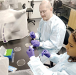Alex and Kynnedi working on agar plates