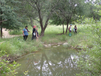 students at water edge