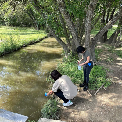 students taking water sample