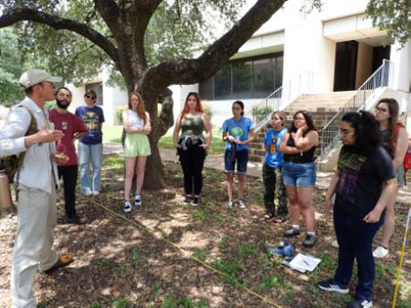 students measuring ground cover