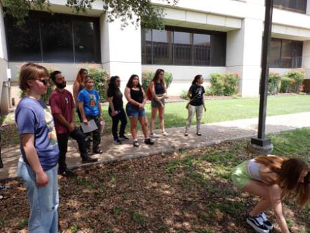 students watching line transect technique demonstration