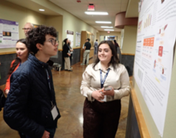 Christian Ramos reviewing posters