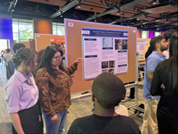 Tia Kline and Alisia Romero presenting a poster