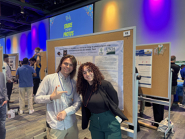 Gabriel Mitchell and Selma Akhrass presenting a poster