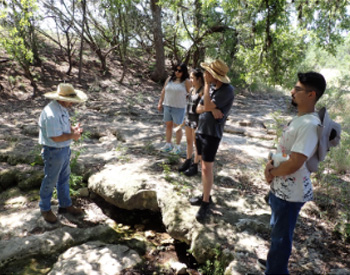 Scott Gardner and students in woods