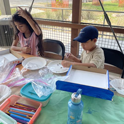 campers making insect boxes