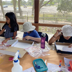 campers making insect boxes