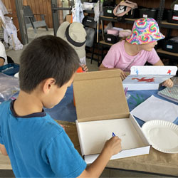 campers making insect boxes