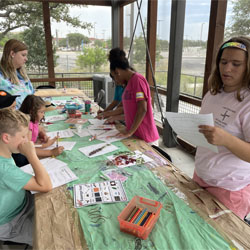 campers working with leaves