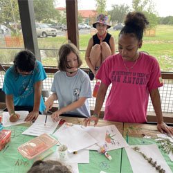 campers working with leaves