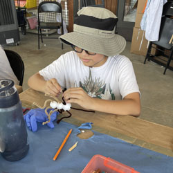 camper making insect model