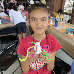 camper displaying insect model