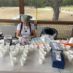 campersorting beads into paper cups