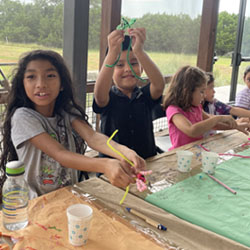 campers making bead key chains