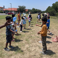 campers playing with water balloons