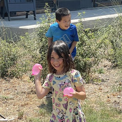 campers playing with water balloons