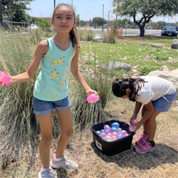 campers playing with water balloons