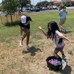 campers playing with water balloons