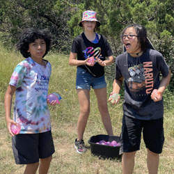 campers playing with water balloons