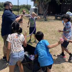 campers playing with water balloons