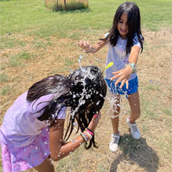 campers playing with water balloons