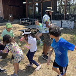 campers playing with water balloons