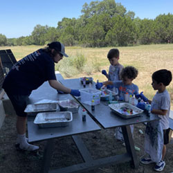 campers making tie dye shirts